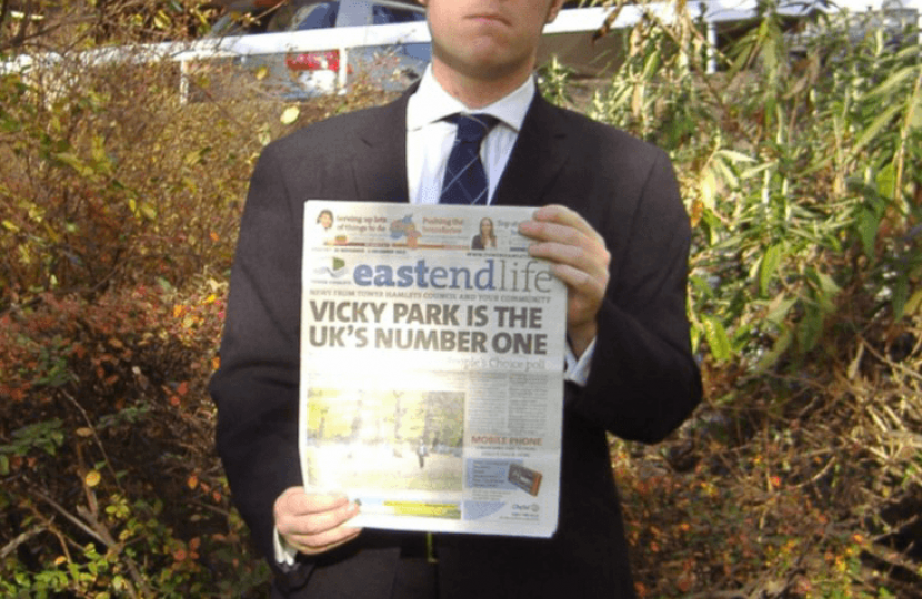 Cllr Craig Aston with a copy of East End Life