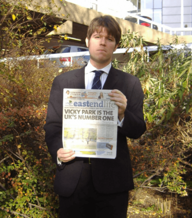 Cllr Craig Aston with a copy of East End Life